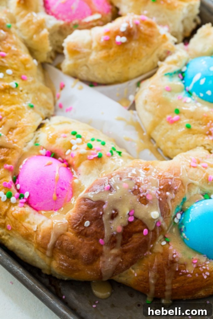 Festive Easter Loaf 4 Five brightly dyed, uncooked eggs nestled into braided Easter Egg Bread dough before baking.