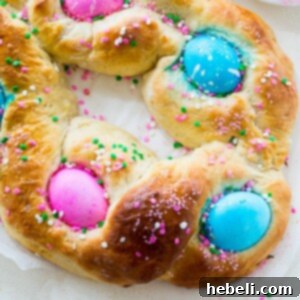 Freshly baked Easter Egg Bread with vibrant eggs.