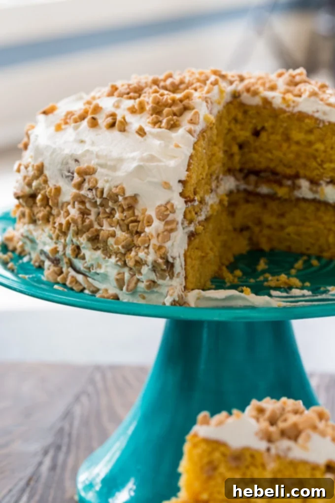 Buttery Toffee Brittle Cake 3 Two layers of Butter Brickle Cake with creamy white frosting and scattered toffee pieces