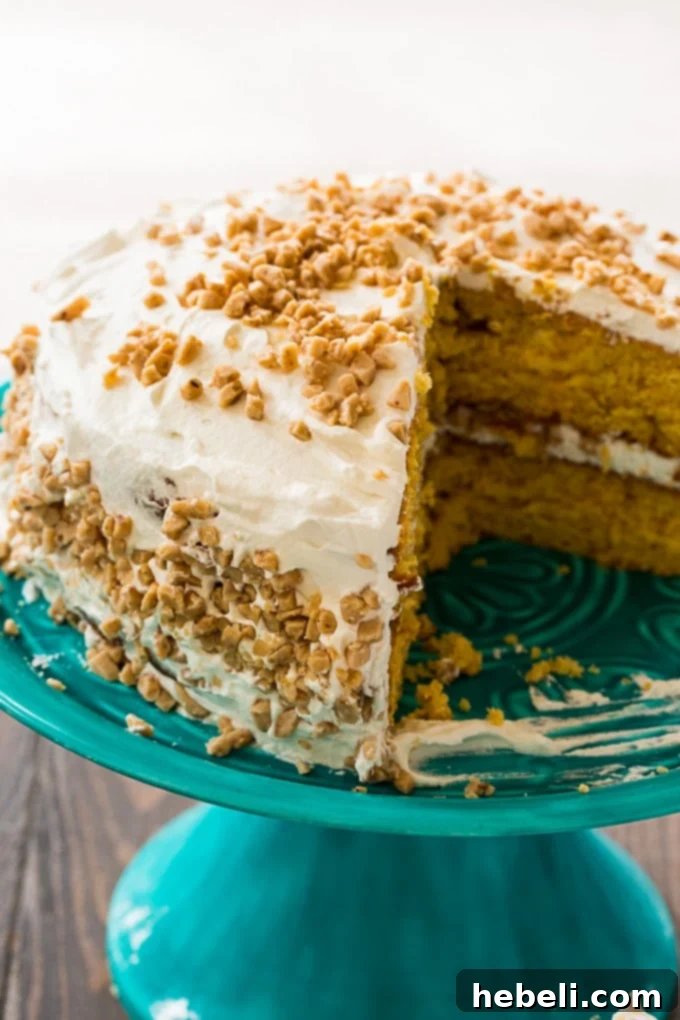 Buttery Toffee Brittle Cake 4 A slice of Butter Brickle Cake on a plate, showing layers and toffee bits