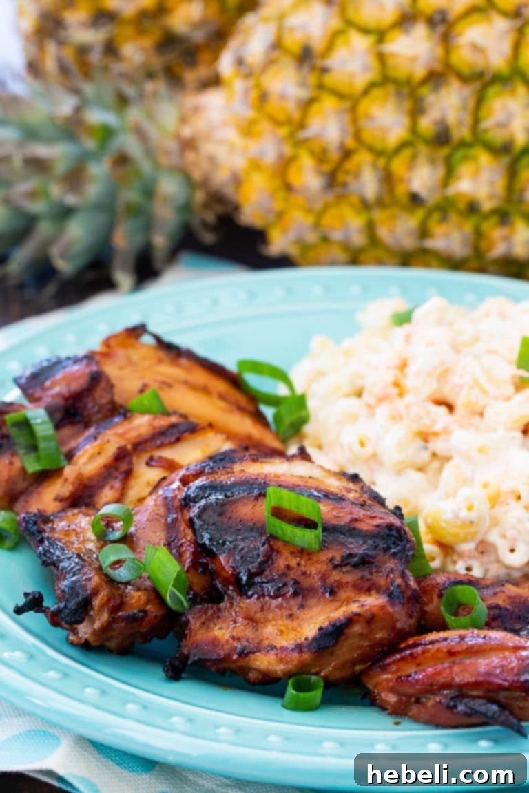 Flame-Kissed Huli Huli Chicken 3 Plated Huli Huli Chicken with a side of Hawaiian Macaroni Salad.