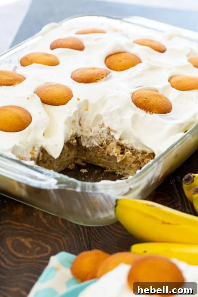 Luscious Banana Pudding Poke Cake 3 A full 9x13-inch pan of freshly baked Banana Pudding Poke Cake, ready to be poked and filled with creamy pudding.