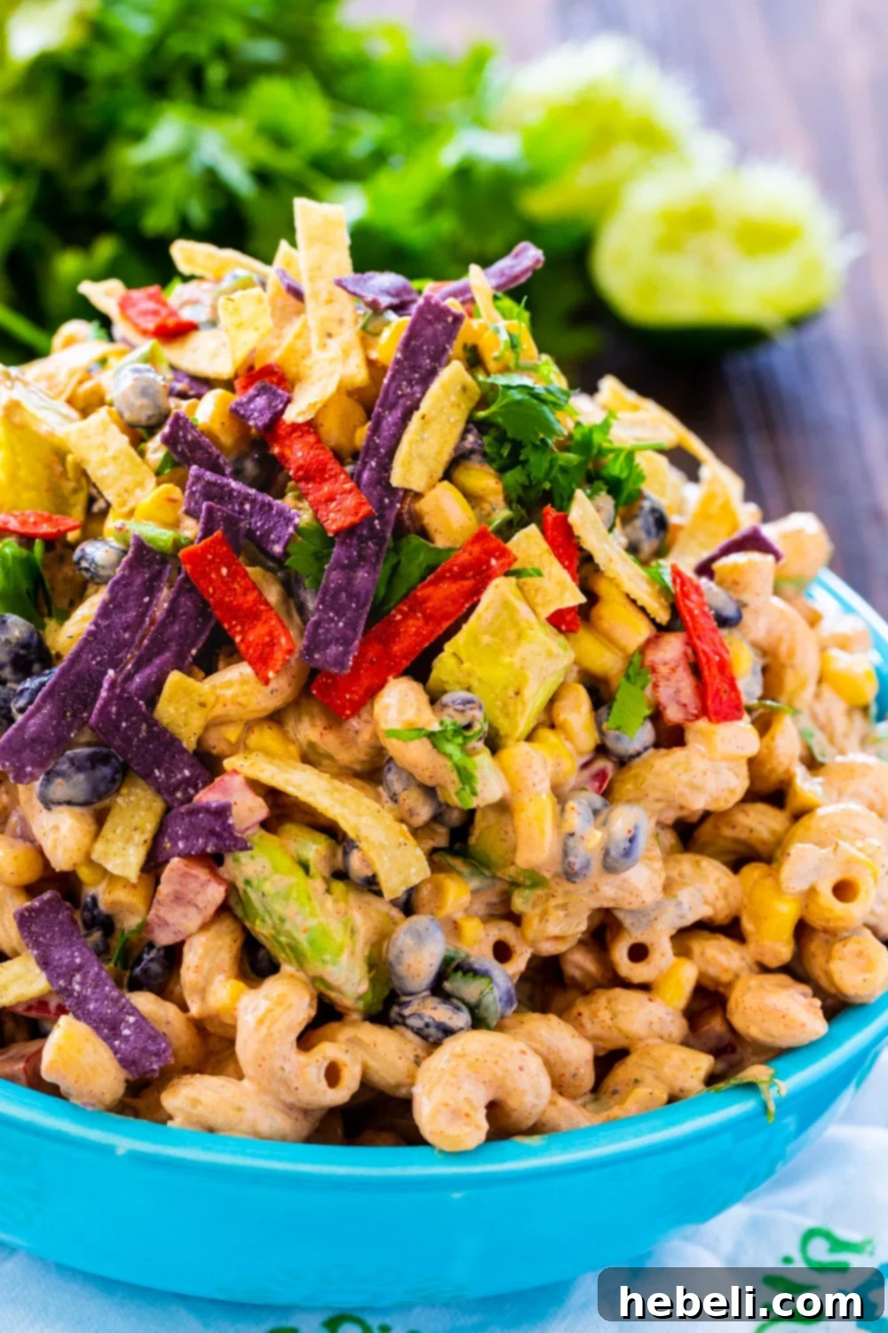 Easy Tex-Mex Pasta Salad Recipe 4 A large serving of Tex-Mex Pasta Salad in a bright blue bowl, ready to be enjoyed as a refreshing and flavorful dish.