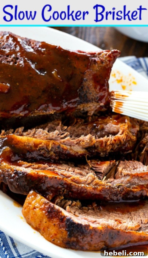 A large, perfectly cooked Slow Cooker Beef Brisket, showcasing its tender texture.