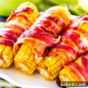 Fiery Bacon Corn Wraps 5 Spicy Bacon Wrapped Corn on a serving platter, showcasing its crispy texture.