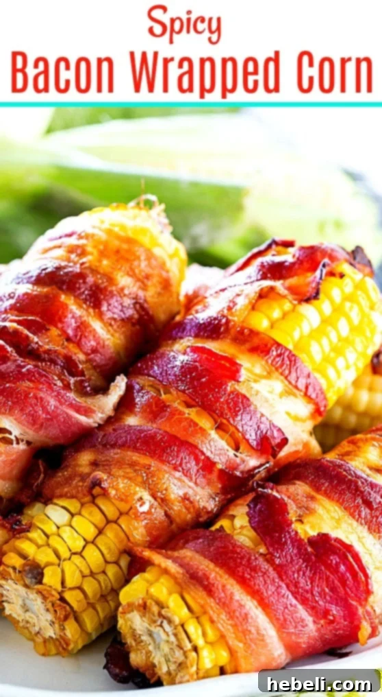 Fiery Bacon Corn Wraps 7 A plate featuring two perfectly cooked Spicy Bacon Wrapped Corn cobs, ready to be served.