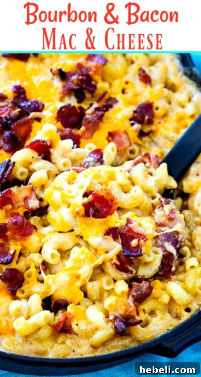A large serving of Bourbon and Bacon Mac and Cheese, showcasing the golden-brown crust and melted cheese, ready for serving.