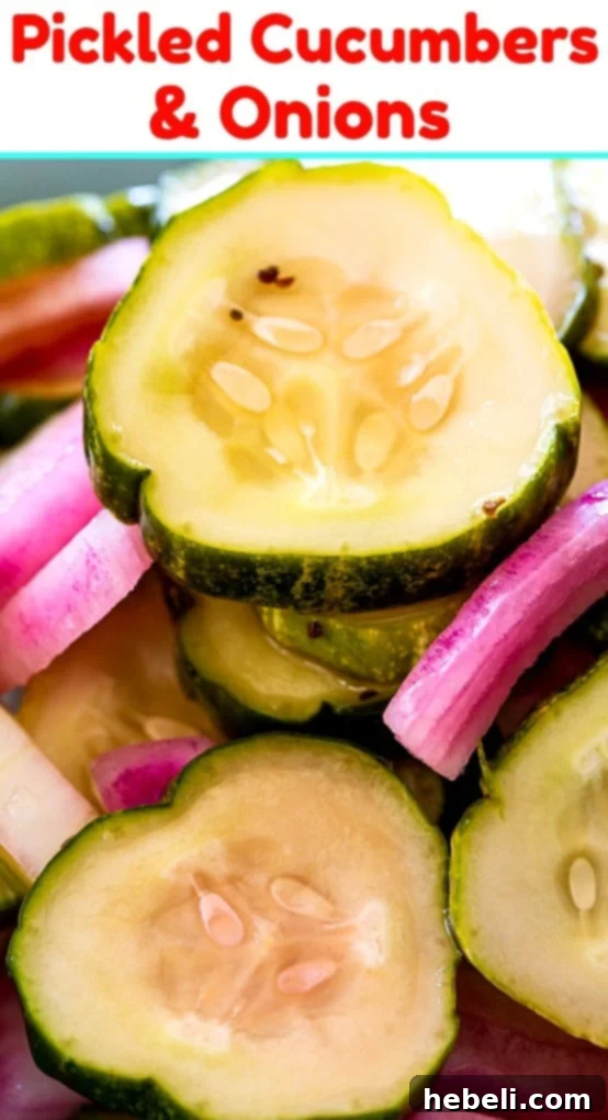 A bowl filled with crisp pickled cucumbers and onions, garnished with fresh dill sprigs, ready to be served.