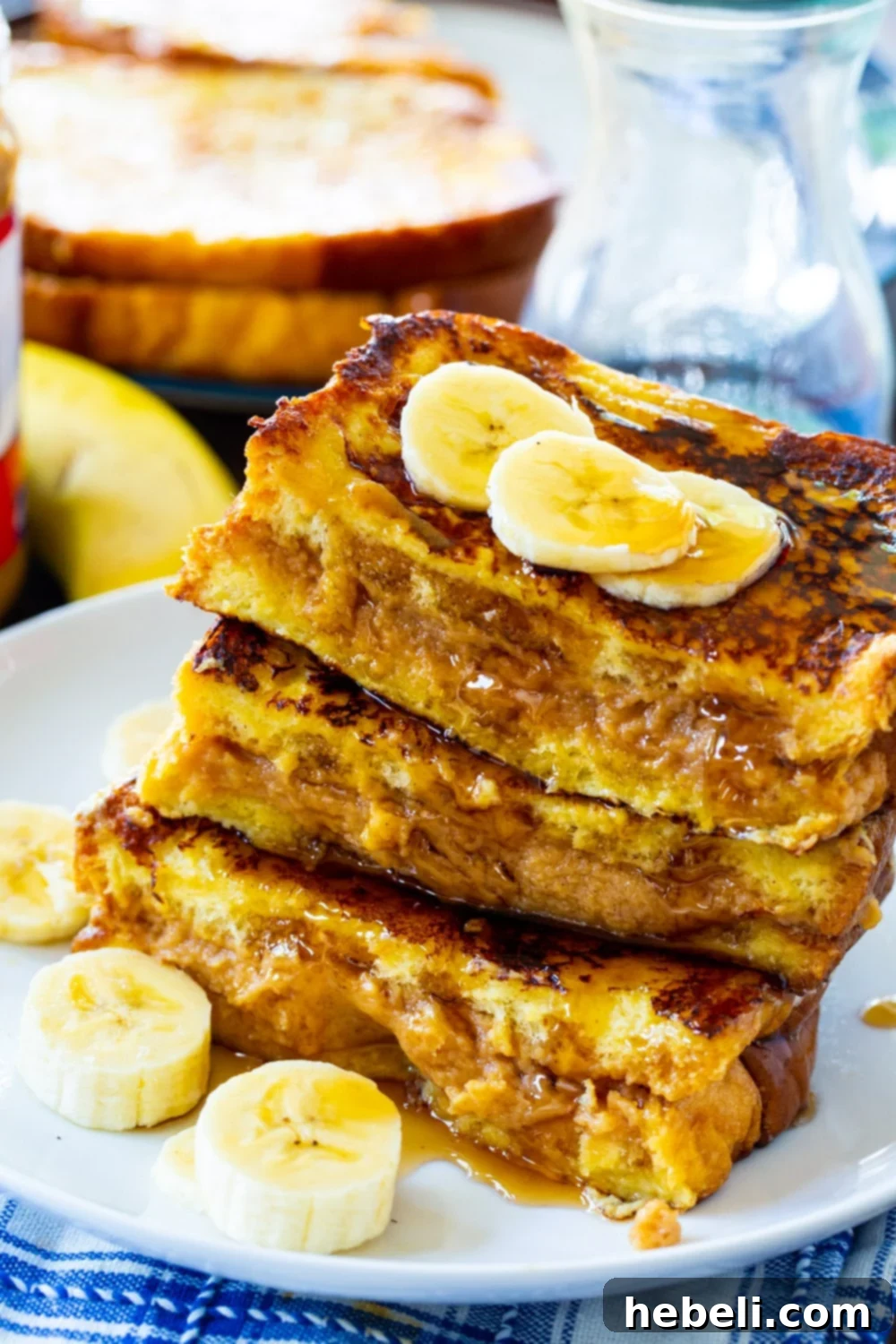 Close-up of a Peanut Butter Stuffed French Toast slice, showing the creamy filling inside.