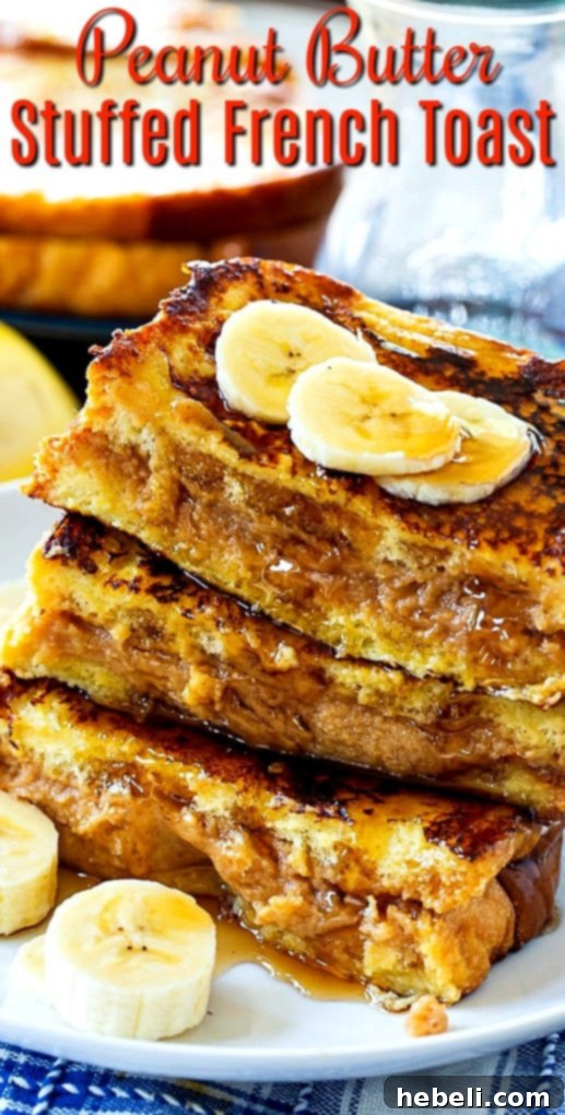 A stack of perfectly golden Peanut Butter Stuffed French Toast slices on a plate.