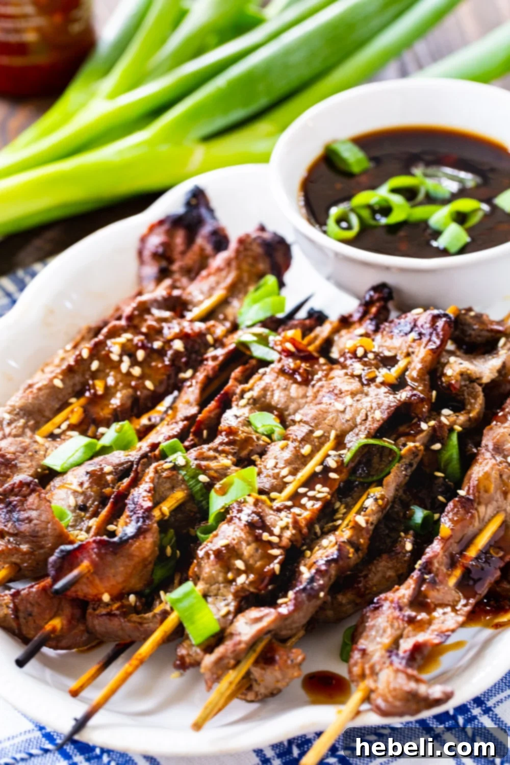Steak Skewers with a bowl of Korean BBQ dipping sauce, ready to serve.