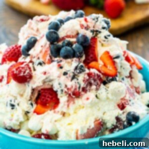 A small image of the Red, White & Blue Cheesecake Salad, showcasing its vibrant layers of fresh berries and creamy cheesecake filling.