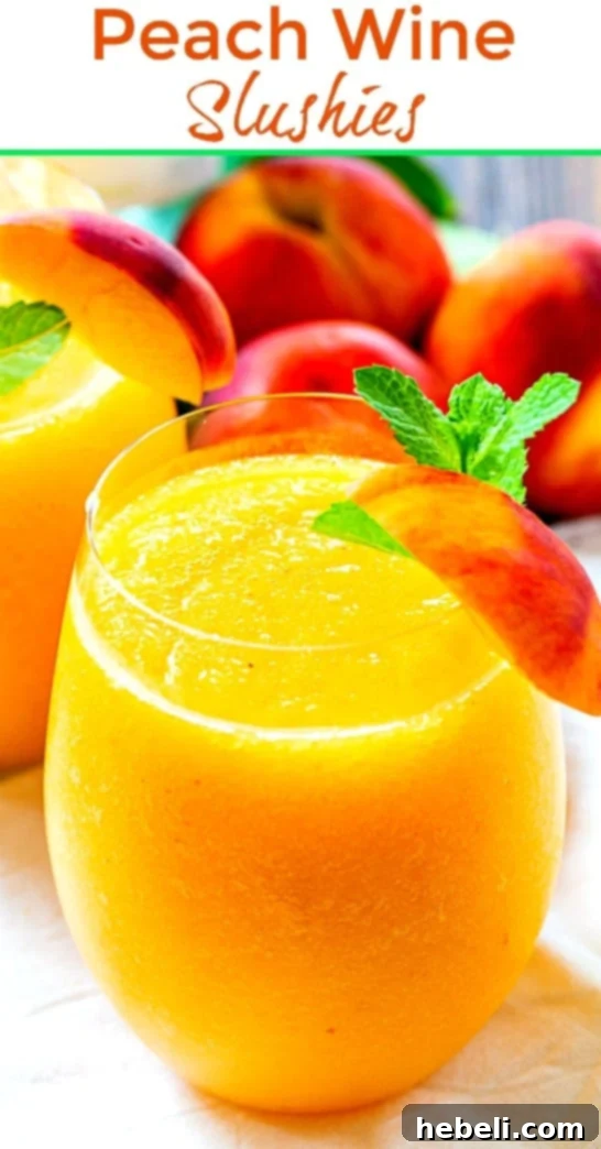 A full glass of Peach Wine Slushie with fresh peach garnish, ready to be enjoyed.