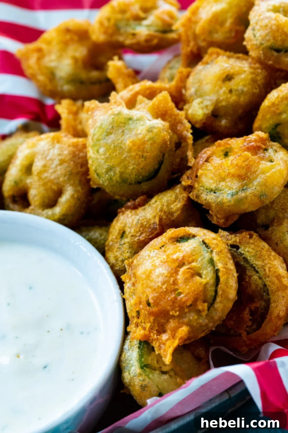 Close-up of golden and crispy Deep Fried Jalapeno Slices, showing their irresistible texture.