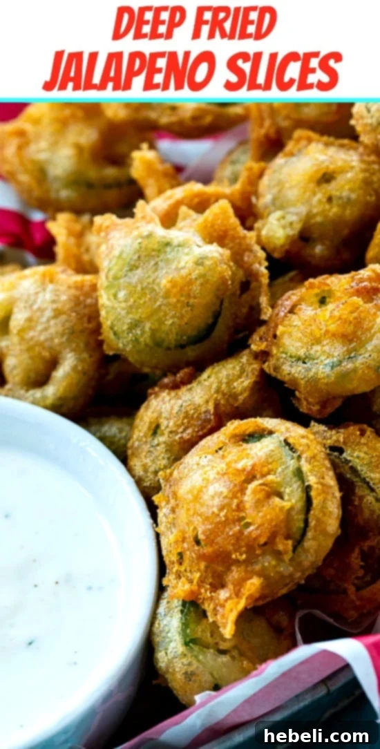 Delicious Deep Fried Jalapeno Slices perfectly arranged for serving, emphasizing their crispy texture.
