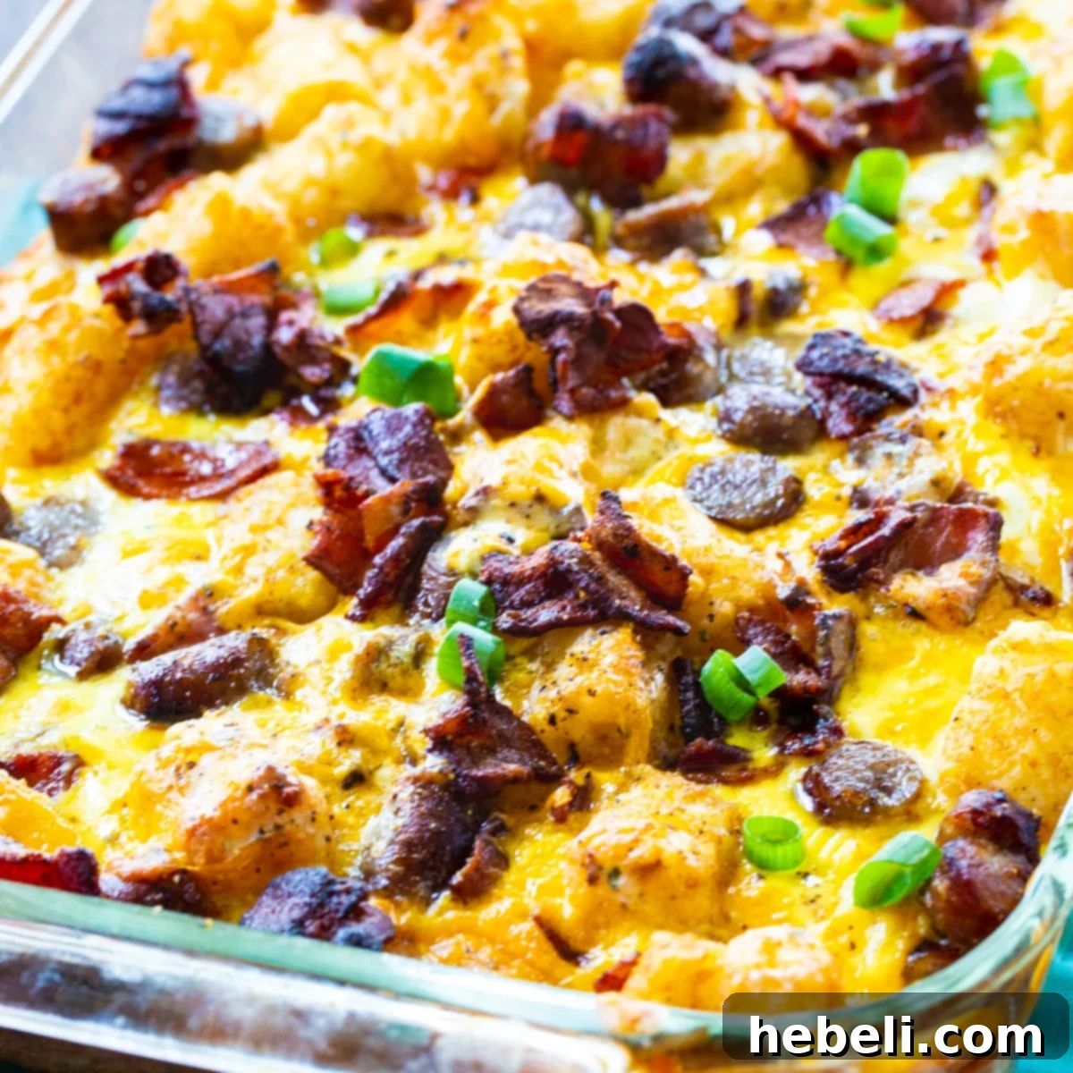 Hearty Tater Tot Breakfast Bake 2 Loaded Tater Tot Breakfast Casserole in a baking dish, freshly baked and golden brown.