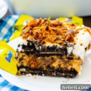 Slice of Butterfinger Oreo Icebox Pie on a plate.