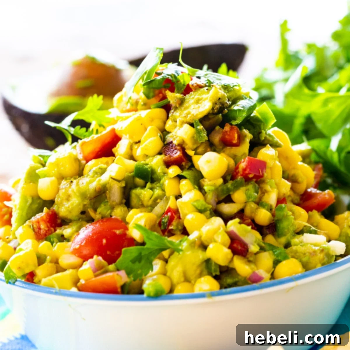 A vibrant bowl of Avocado and Corn Salsa, showcasing the fresh ingredients and inviting textures.