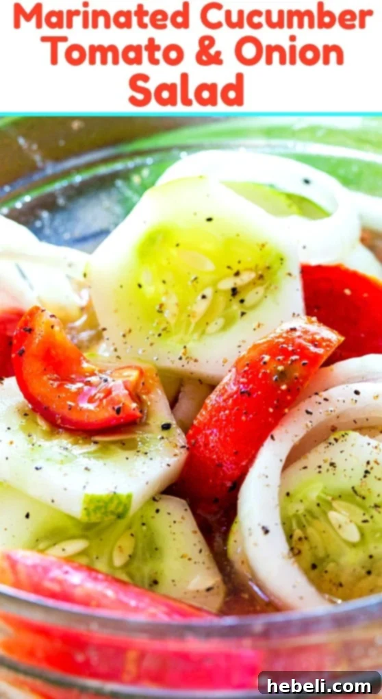 A vibrant and fresh Marinated Cucumbers, Tomatoes, and Onions salad presented in a glass bowl, emphasizing its ease as a summer side dish.