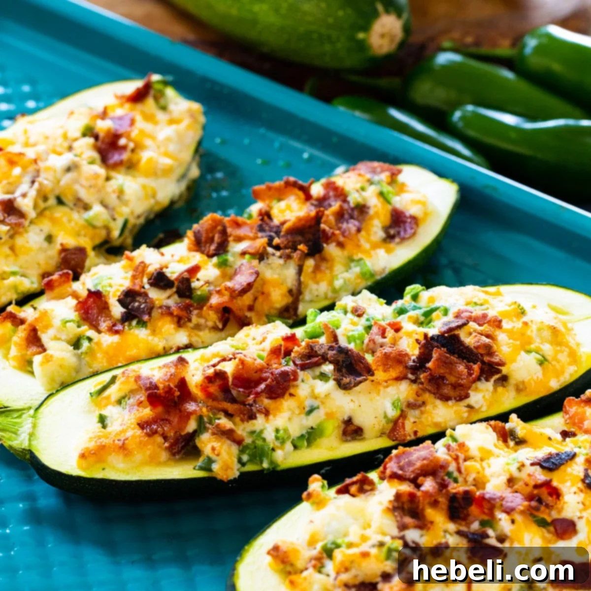 Jalapeno Popper Zucchini Boats on baking sheet.