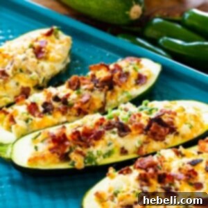 Jalapeno Popper Zucchini Boats on baking sheet.