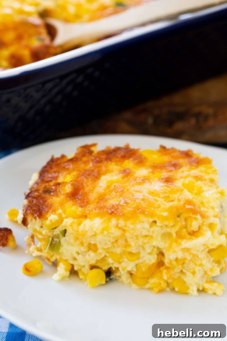 A close-up of Three Cheese Corn Pudding, showing its rich texture and golden color, ready to be served.