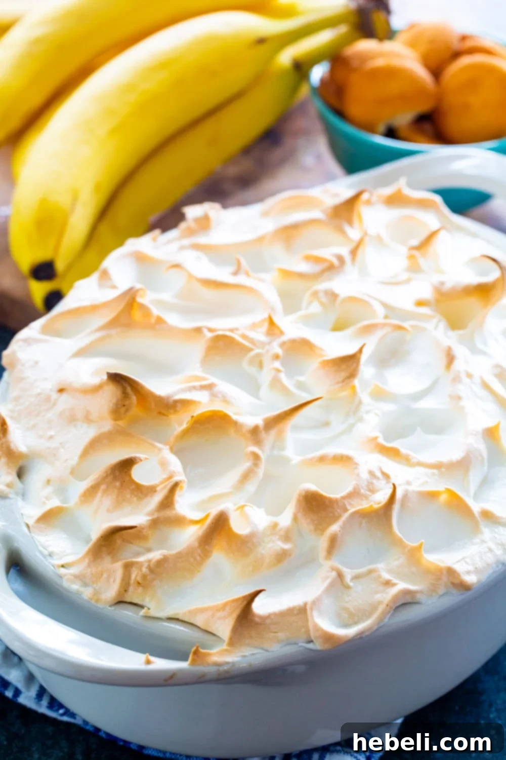 Banana Pudding topped with Meringue in an oval baking dish.