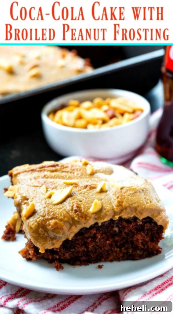 The complete Coca-Cola Cake with Broiled Peanut Frosting, showcasing its rich, dark chocolate base and a generous layer of perfectly broiled peanut butter icing, topped with extra chopped peanuts.