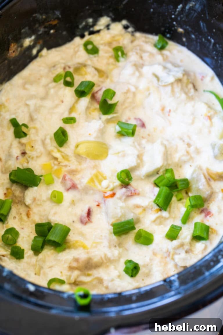 Crock Pot Crab Artichoke Dip 3 Close-up of creamy Crockpot Crab Artichoke Dip, showing its rich texture and delicious appeal.