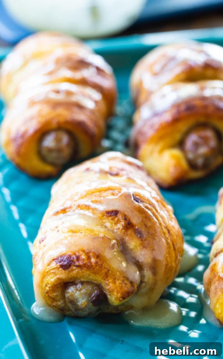 Cinnamon Roll Pigs in a Blanket beautifully arranged on a serving platter, ready to be enjoyed.
