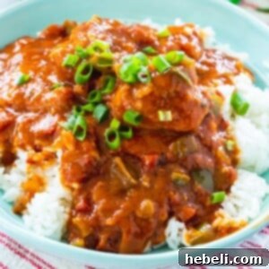 A top-down view of Chicken Sauce Piquant in a bowl, showing the rich sauce and chicken pieces, ready to be served.