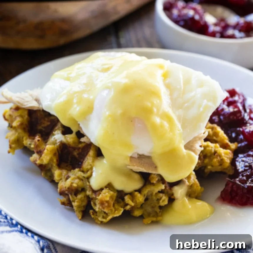 Thanksgiving Eggs Benedict - A savory stuffing waffle topped with roasted turkey, a poached egg, and hollandaise sauce.