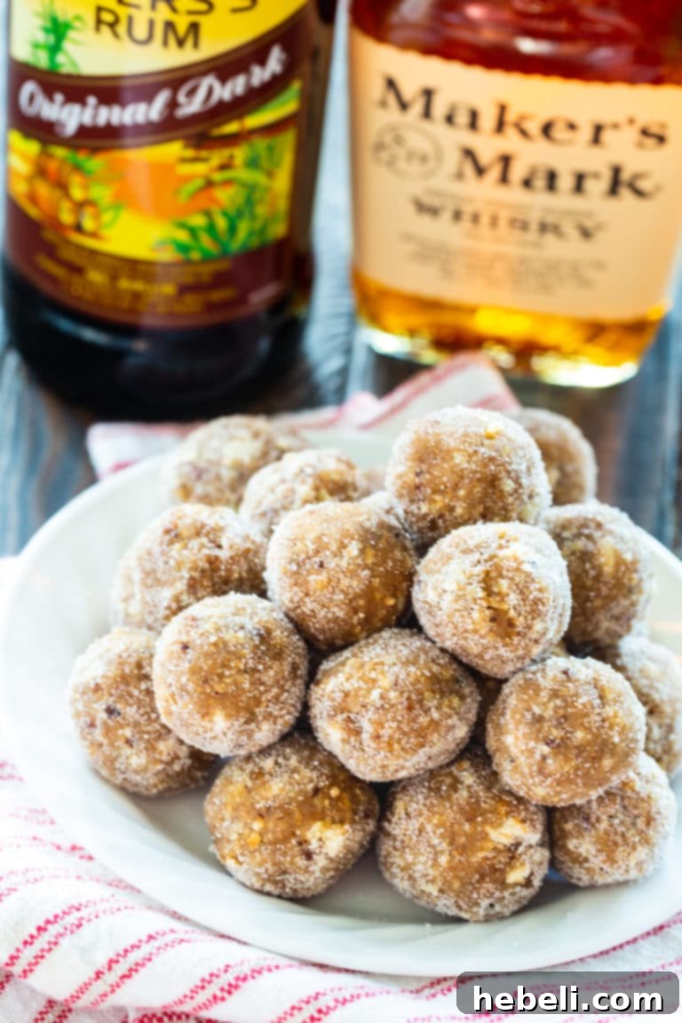 A close-up shot of Classic Rum Balls, showcasing their sugary coating and rich texture.