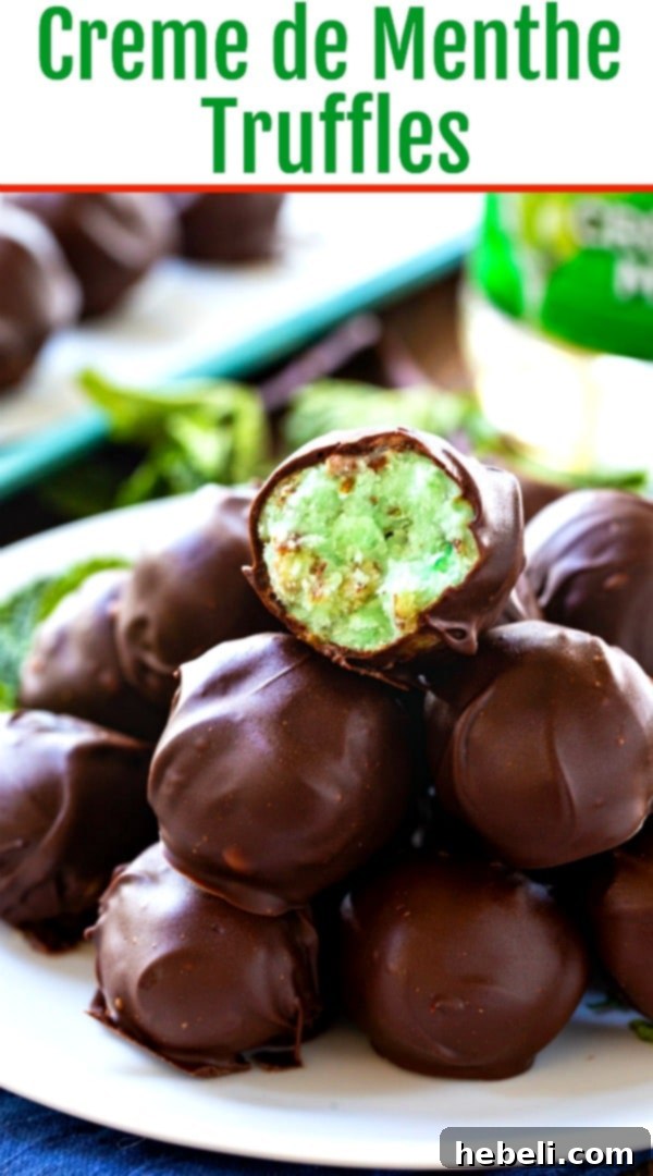 Velvet Mint Truffles 6 A close-up of several finished Creme de Menthe Truffles coated in chocolate, artfully arranged on a serving plate.