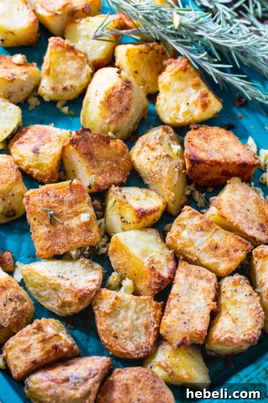 Close-up of golden and crisp roasted potatoes, showcasing their perfect texture.