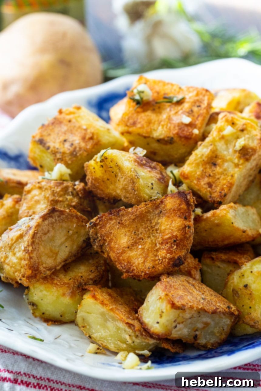 A vibrant platter of fabulously crispy roasted potatoes, seasoned with herbs.