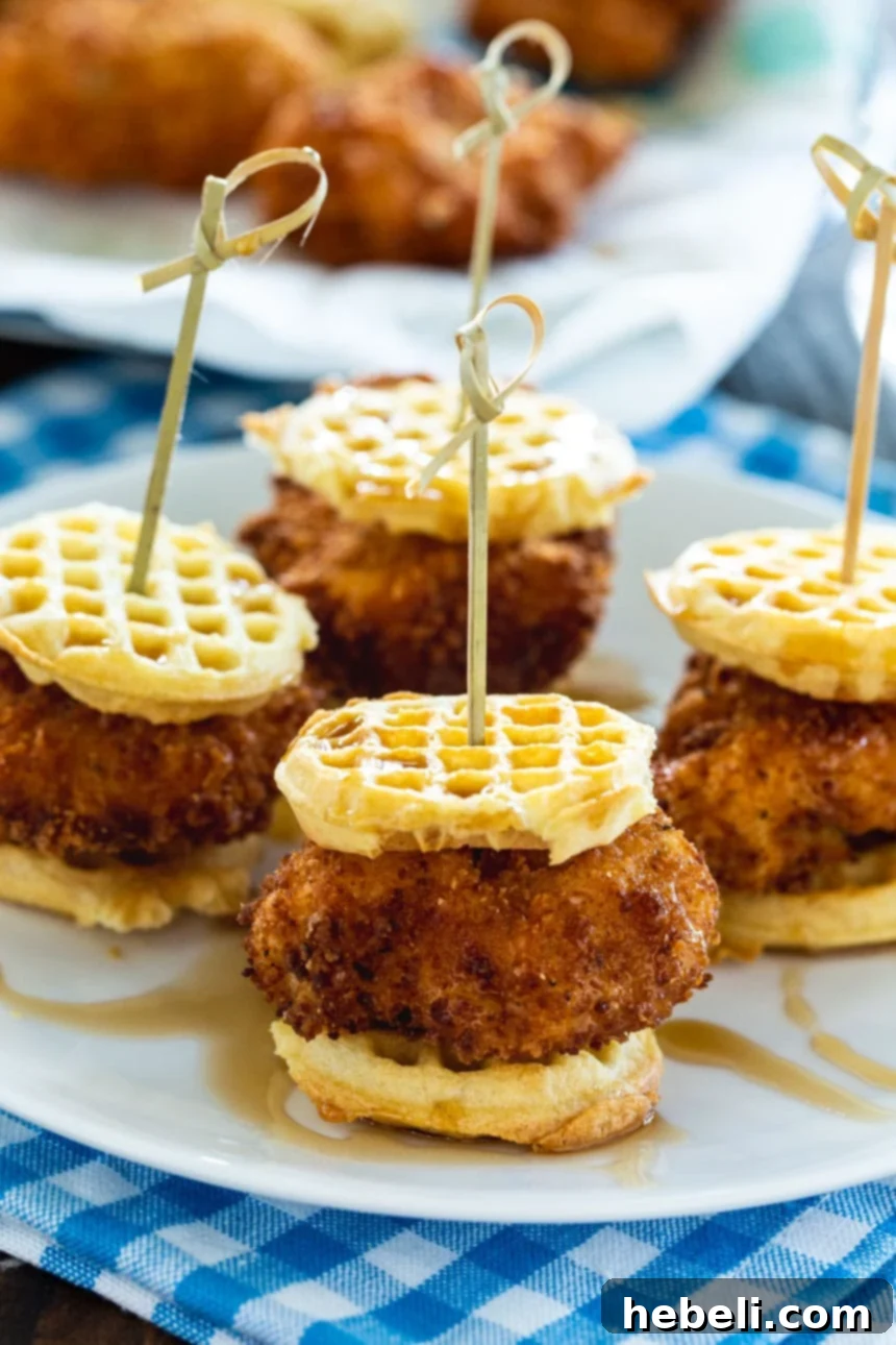 Mini Chicken and Waffle Sliders presented beautifully on a serving platter, ready for guests.