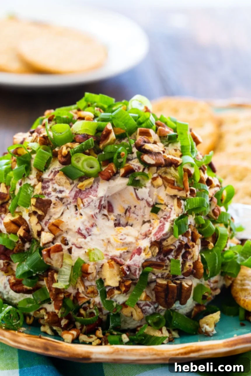 A close-up view of the interior texture of a Chipped Beef Cheese Ball, showing the finely chopped dried beef and cheddar cheese mixed into the creamy base.