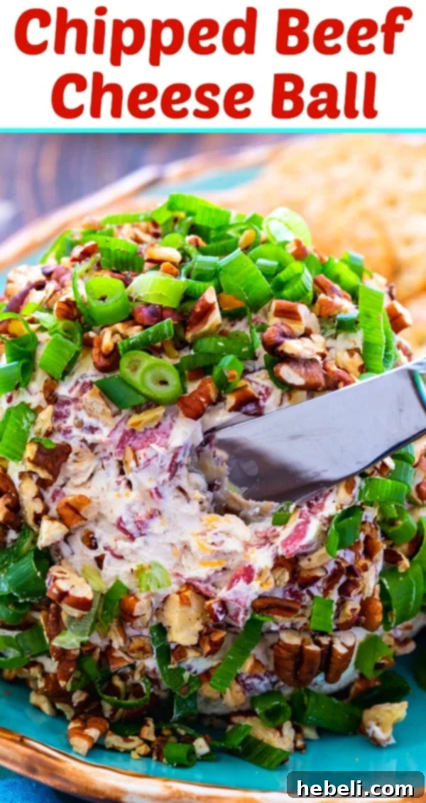 An overhead shot of a finished Chipped Beef Cheese Ball, showcasing its inviting texture and presentation, ready to be enjoyed.