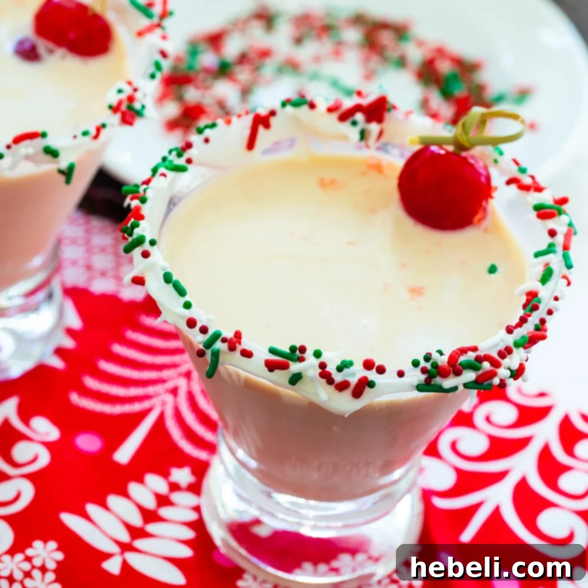 Decadent Sugar Cookie Martini 2 Sugar Cookie Martini in glass with sprinkles on rim.