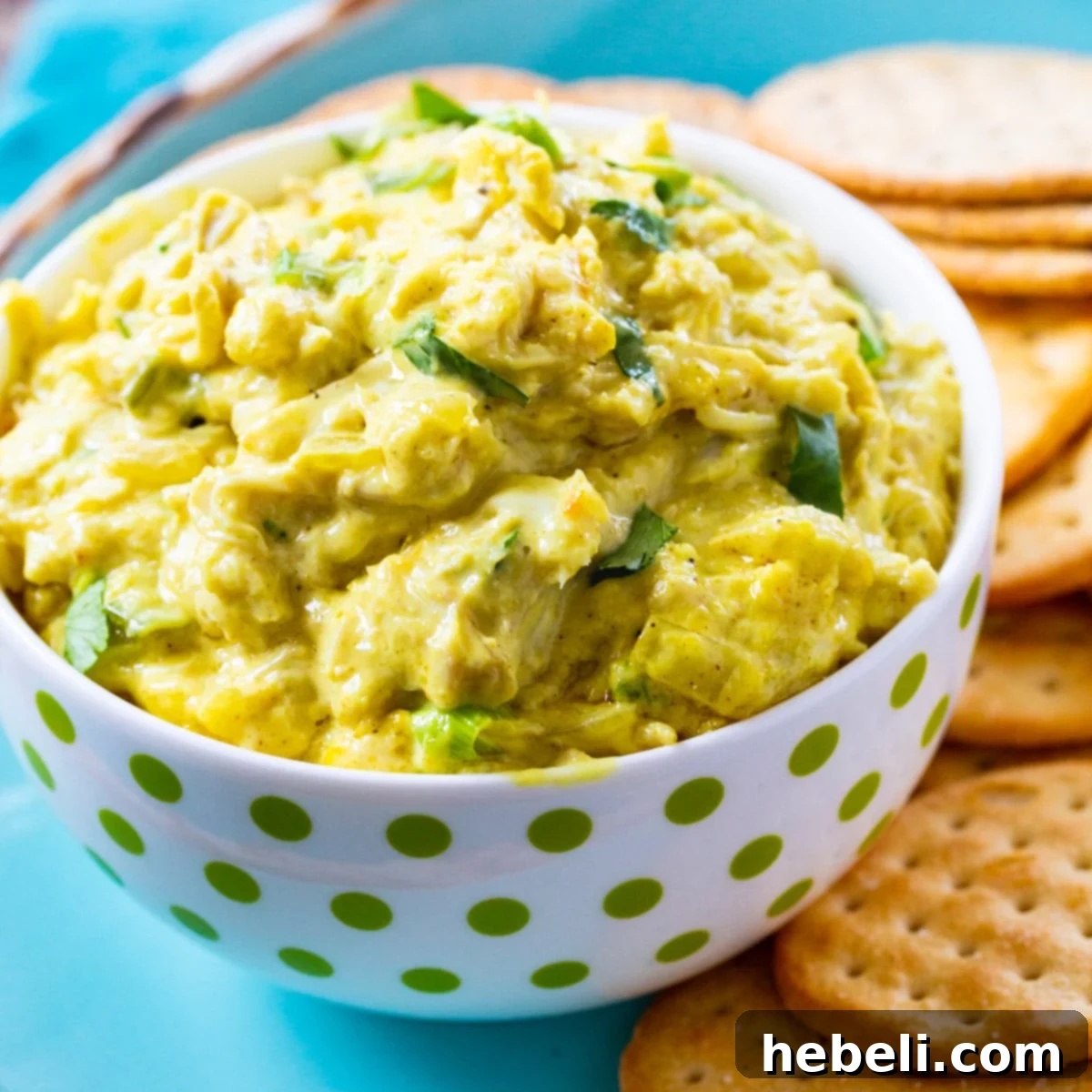 Aromatic Curried Crab Dip 2 Bowl full of Curried Crab Dip surrounded by crackers.