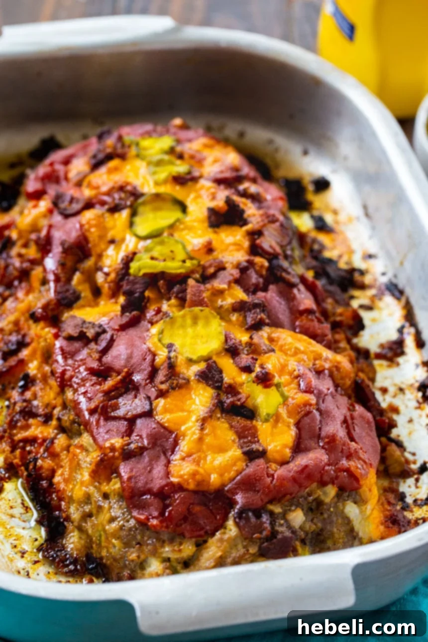Loaded Bacon Cheeseburger Meatloaf 3 A closer look at the Bacon Cheeseburger Meatloaf, showing its texture and cheesy topping.