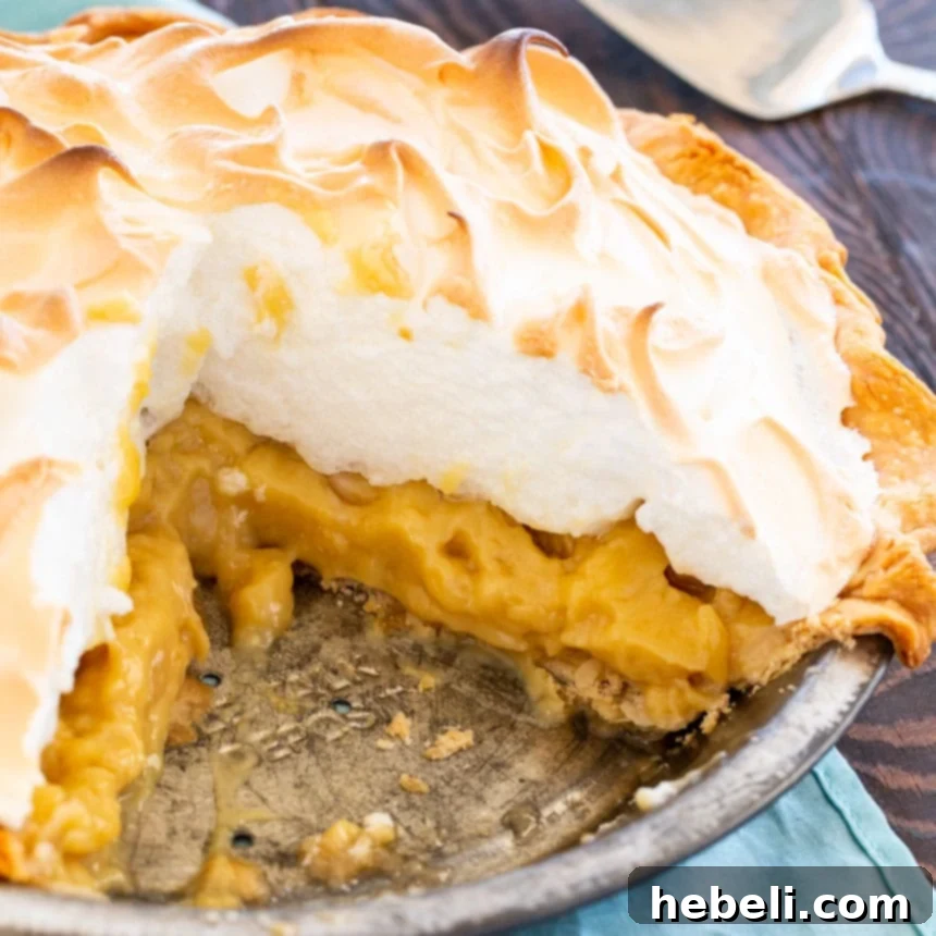 An irresistible close-up of Old-Fashioned Butterscotch Meringue Pie, highlighting its beautiful texture and inviting golden brown meringue.