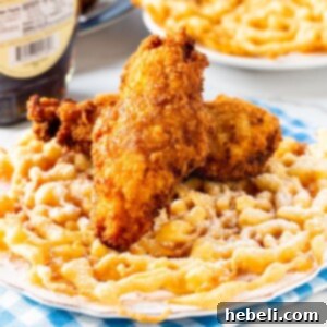 Fried chicken served on a funnel cake with maple syrup