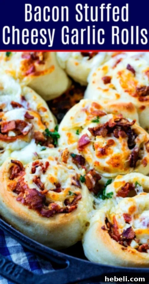 A cluster of freshly baked Cheesy Bacon Garlic Rolls in a cast iron skillet, golden brown with melted cheese and crispy bacon visible.