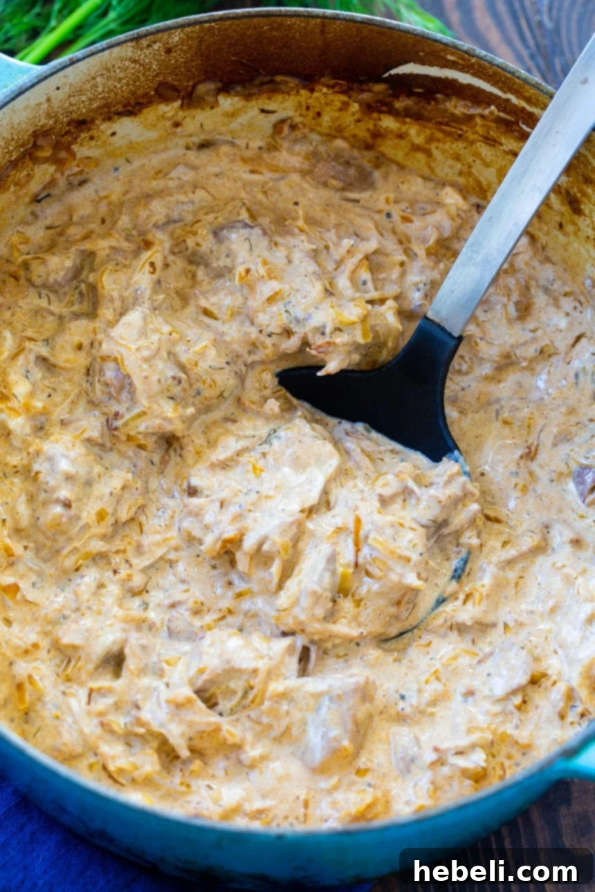 Hungarian Pork Goulash 3 Hungarian Pork Stew simmering in a classic Dutch oven, showcasing its rich texture.