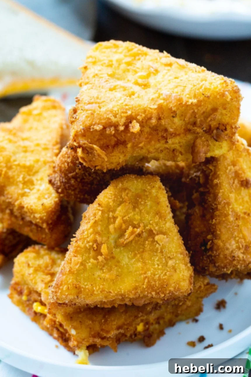 Savory Cheesy French Toast 4 A close-up view of Midwestern Cheese Frenchies, golden and crispy, ready to be enjoyed.