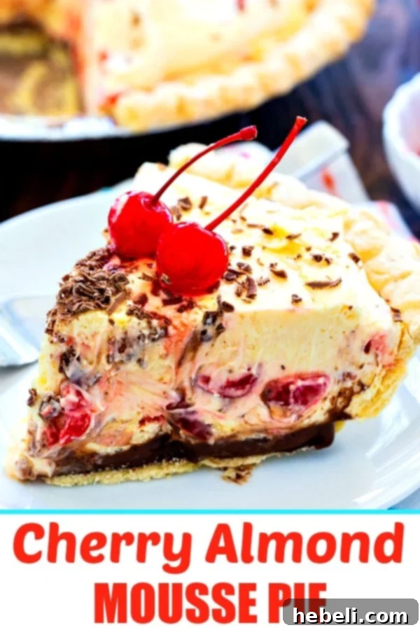 A stunning full view of the Cherry Almond Mousse Pie, showing its vibrant red cherries and elegant presentation, ready for serving, perfect for a dessert table.
