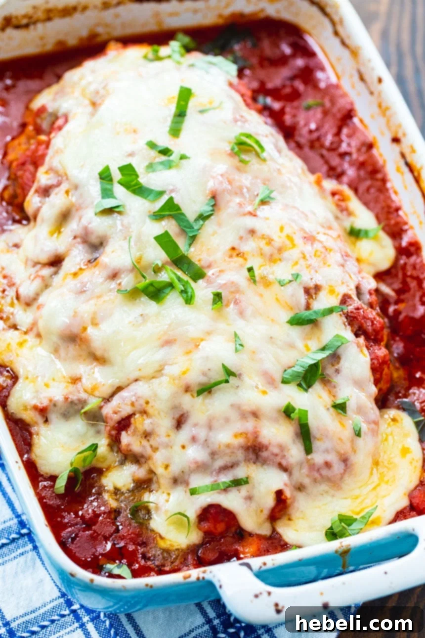 Close-up of Italian Meatloaf with a generous layer of melted Fontina cheese.