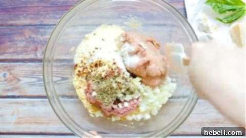 Meatloaf mixture in a bowl, ready to be shaped.